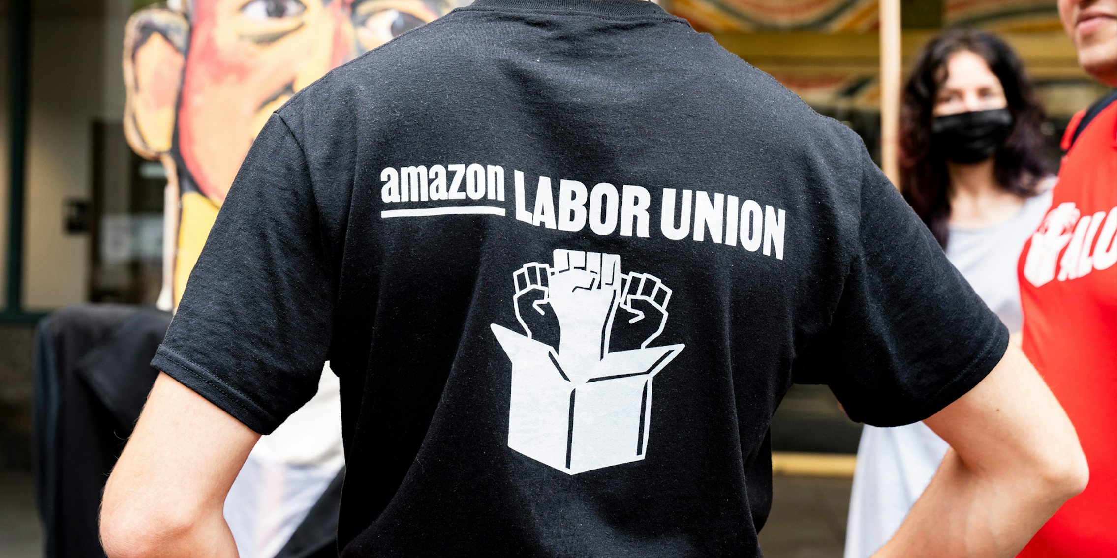 person wearing Amazon Labor Union shirt
