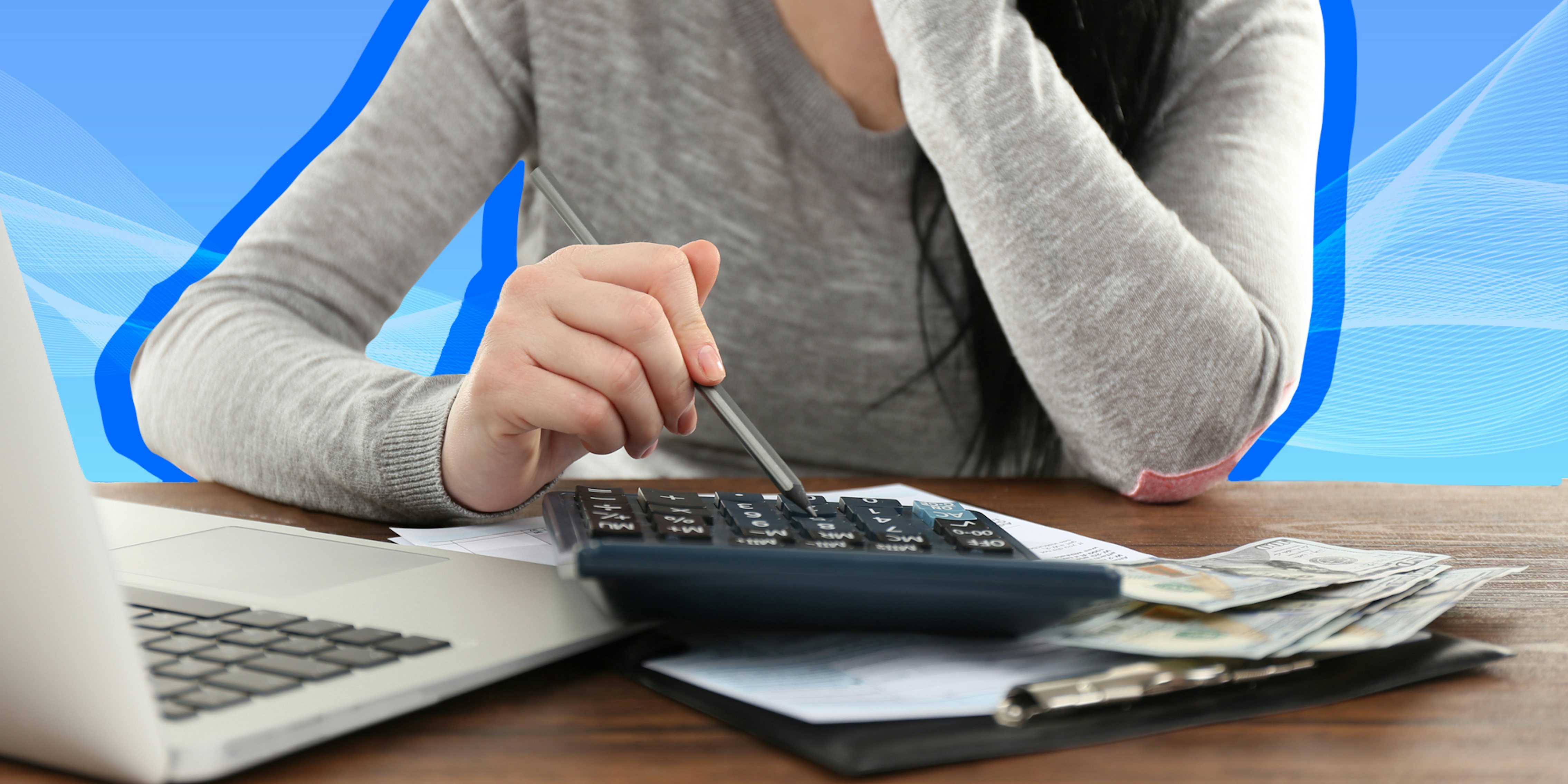 woman using calculator on desk with forms laptop and cash in front of blue background passionfruit remix