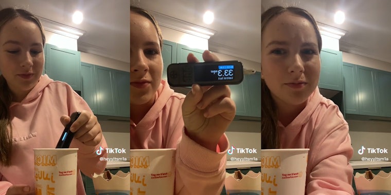 young woman testing mcdonald's soft drink for sugar content