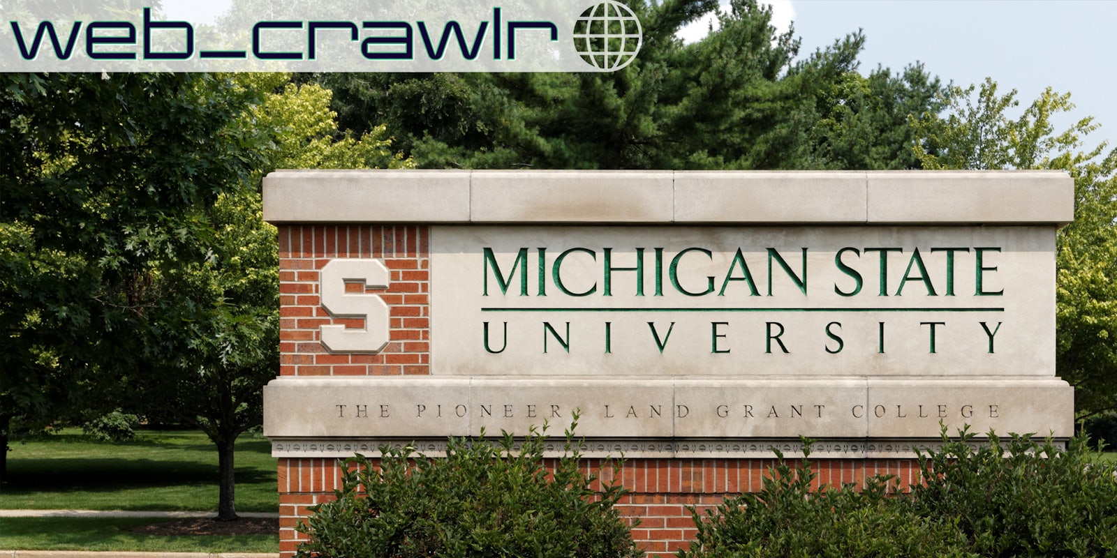 A sign for Michigan State University. The Daily Dot newsletter web_crawlr logo is in the top left corner.
