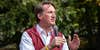 Glenn Youngkin Governor of Virginia speaking into microphone outside