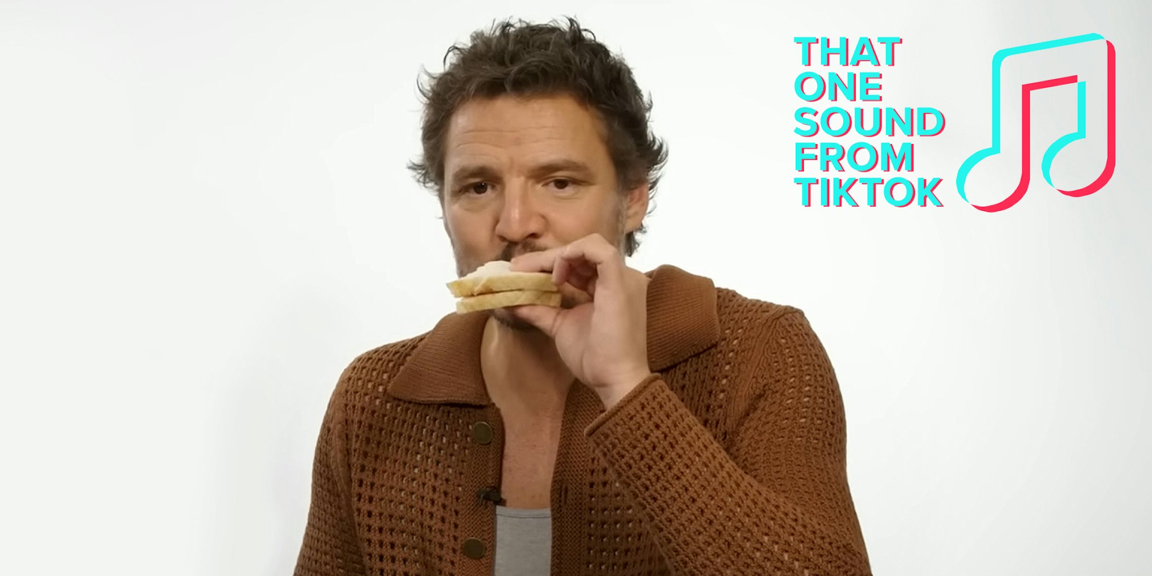 Pedro Pascal eating a peanut butter jelly sandwich in front of light grey background with That One Sound From TikTok logo in top right