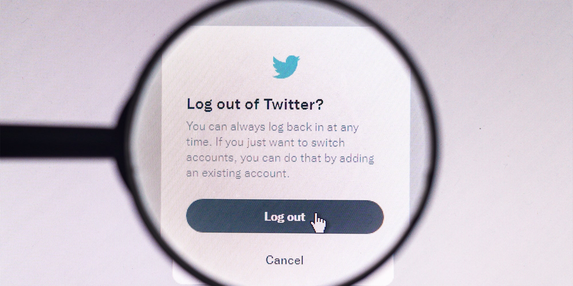 Log out of Twitter on screen 'You can always log back in at any time. If you just want to switch accounts, you can do that by adding an existing account. Log out Cancel' with magnifying glass