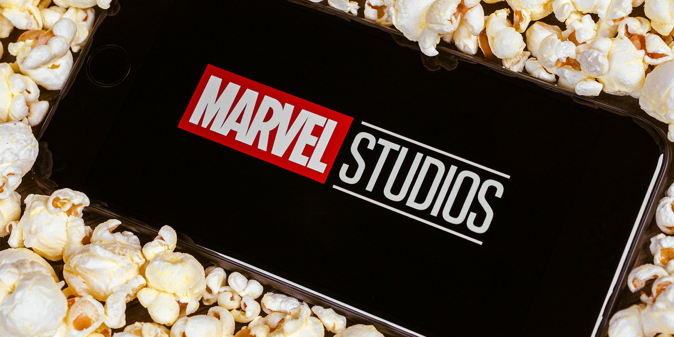 Marvel studios logo on smartphone screen.