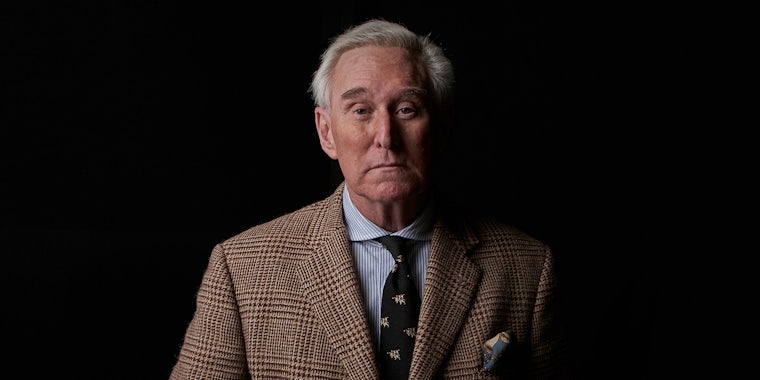 Roger Stone in front of black background