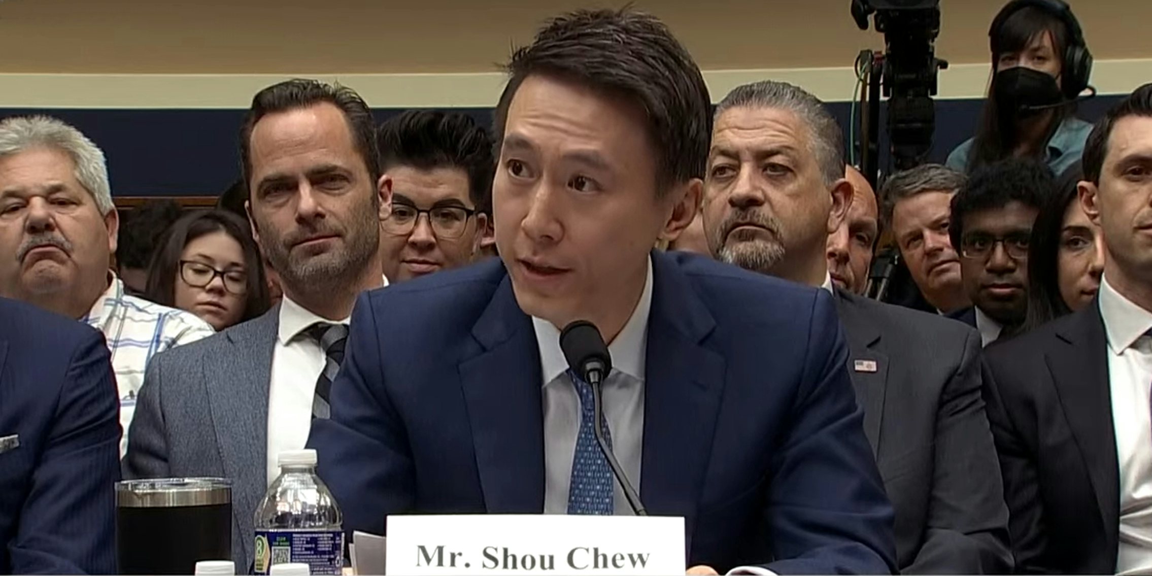 Mr. Shou Chew speaking into microphone