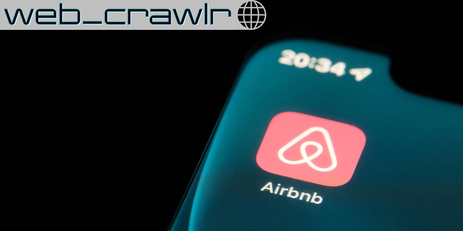 A phone with the Airbnb app on it. The Daily Dot newsletter web_crawlr logo is in the top left corner.