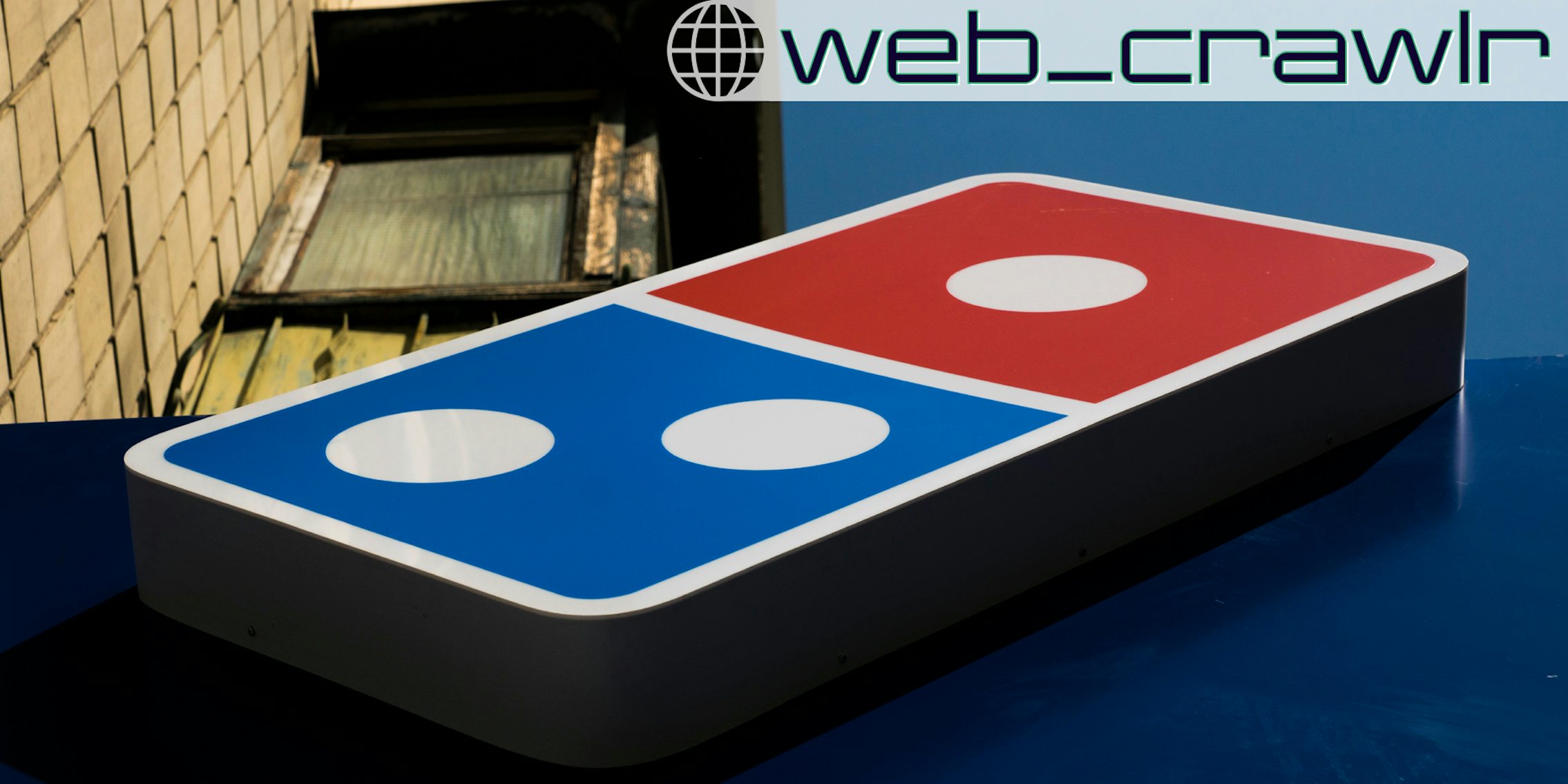 A Domino's sign. The Daily Dot newsletter web_crawlr newsletter is in the top right corner.