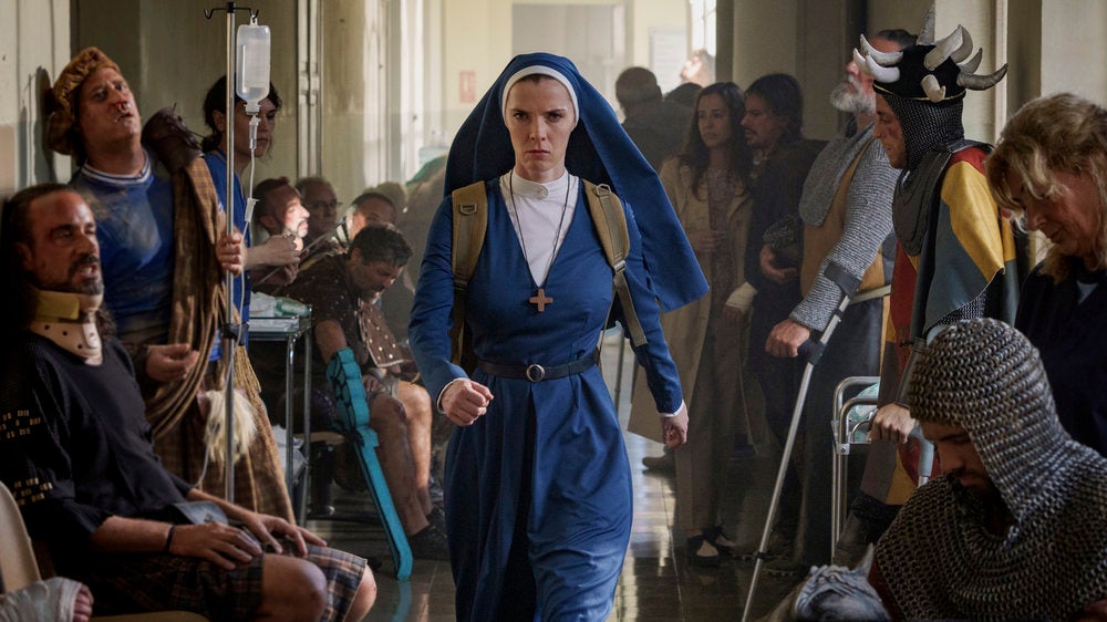a nun in a blue outfit walking quickly in the tv show mrs. davis