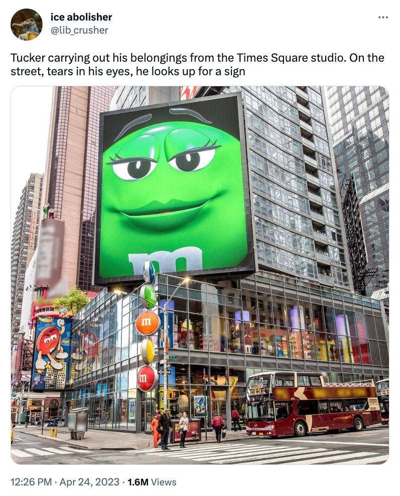 green m&m looking down tucker carlson