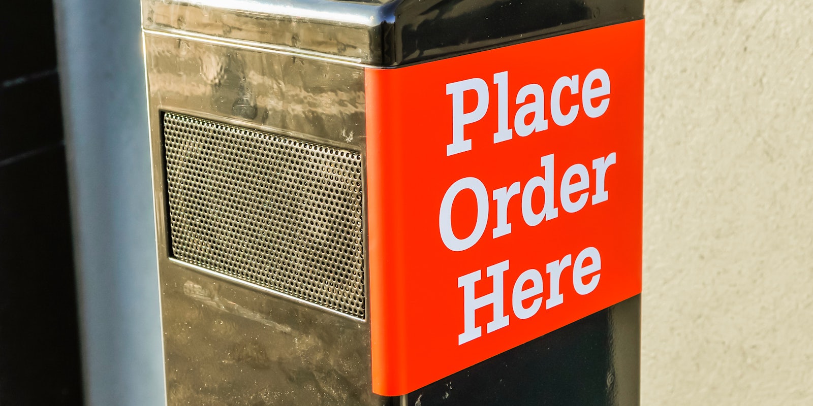 drive thru speaker with sign 'Place Order Here'