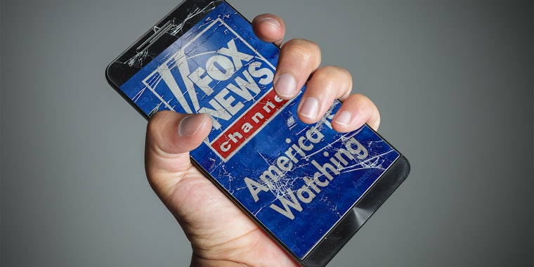Fox News app on cracked phone screen
