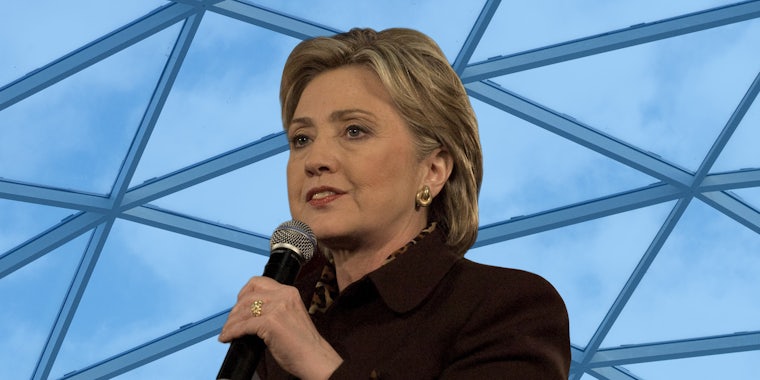 Hillary Clinton 2008 speaking into microphone in front of glass ceiling background