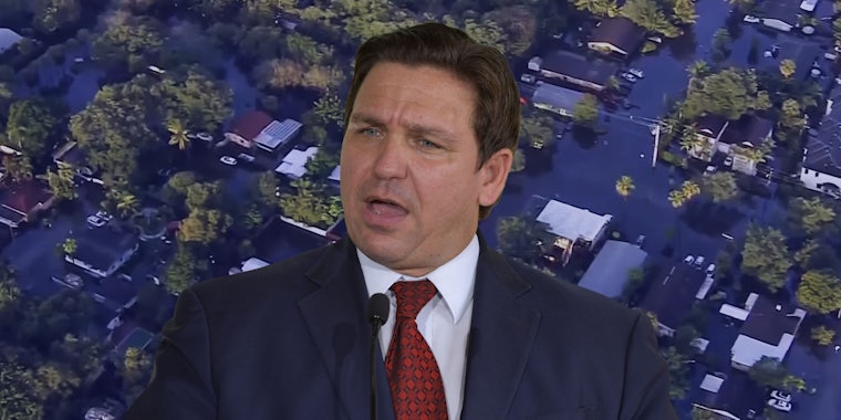 Ron DeSantis speaking in front of drone footage of Fort Lauderdale flood