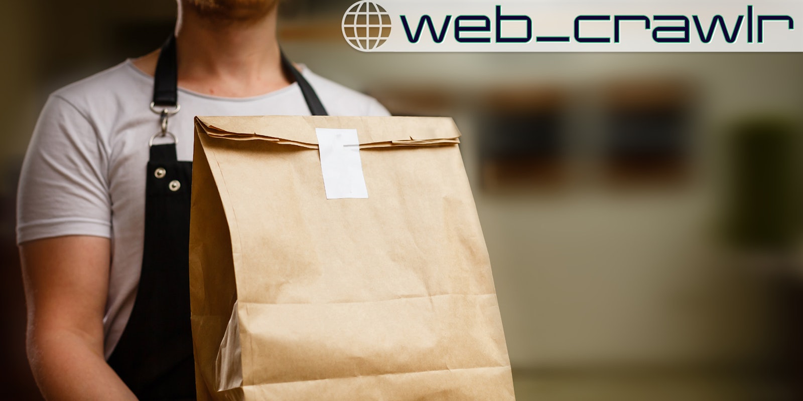 A person holding a brown bag delivery. The Daily Dot newsletter web_crawlr logo is in the top right corner.