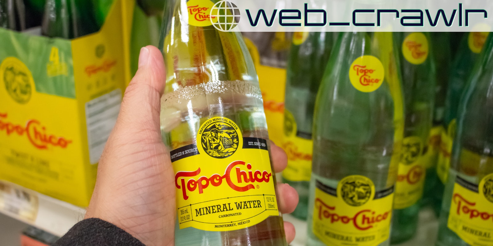 A bottle of Topo Chico. The Daily Dot newsletter web_crawlr logo is in the top right corner.