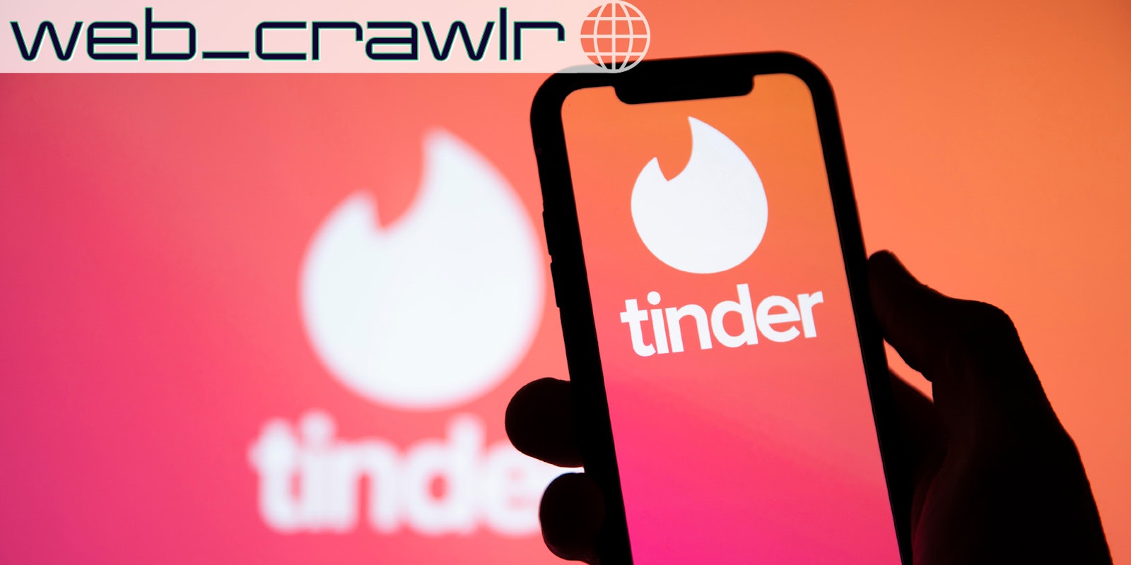 A phone with the Tinder app on it. The Daily Dot newsletter web_crawlr logo is in the top left corner.