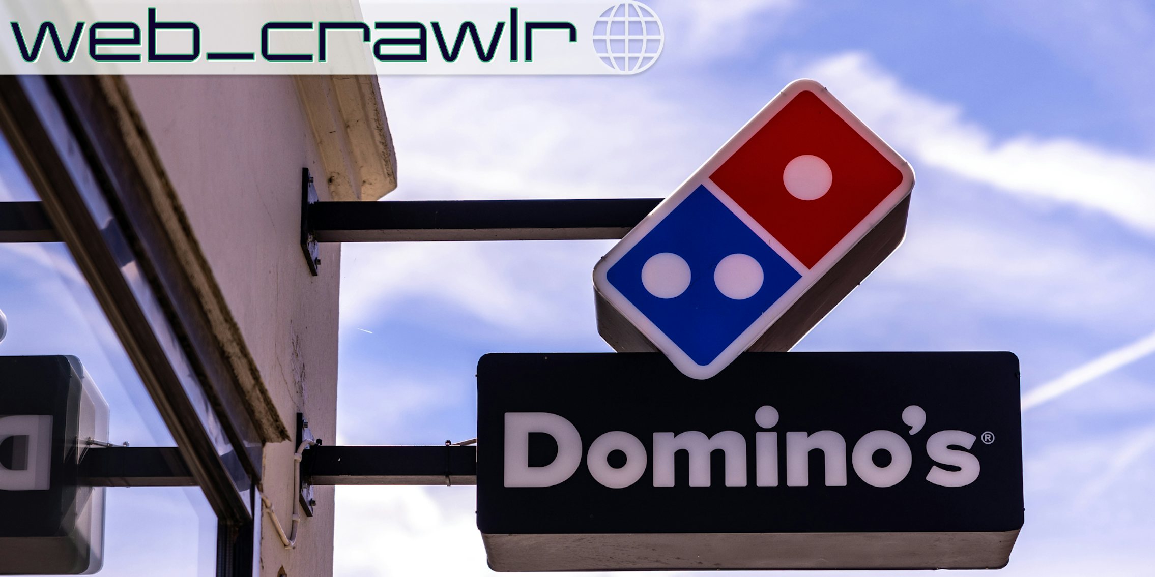 A Domino's Pizza sign. The Daily Dot newsletter web_crawlr logo is in the top left corner.