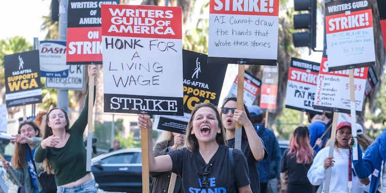 Members of the The Writers Guild of America (WGA) picket outside the Netflix