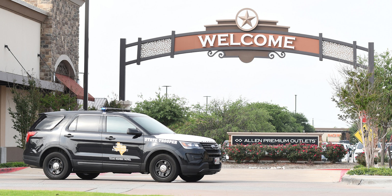 Police secure the parking lot of Allen Premium Outlets mall on Sunday, May 7, 2023 in Allen, TX.