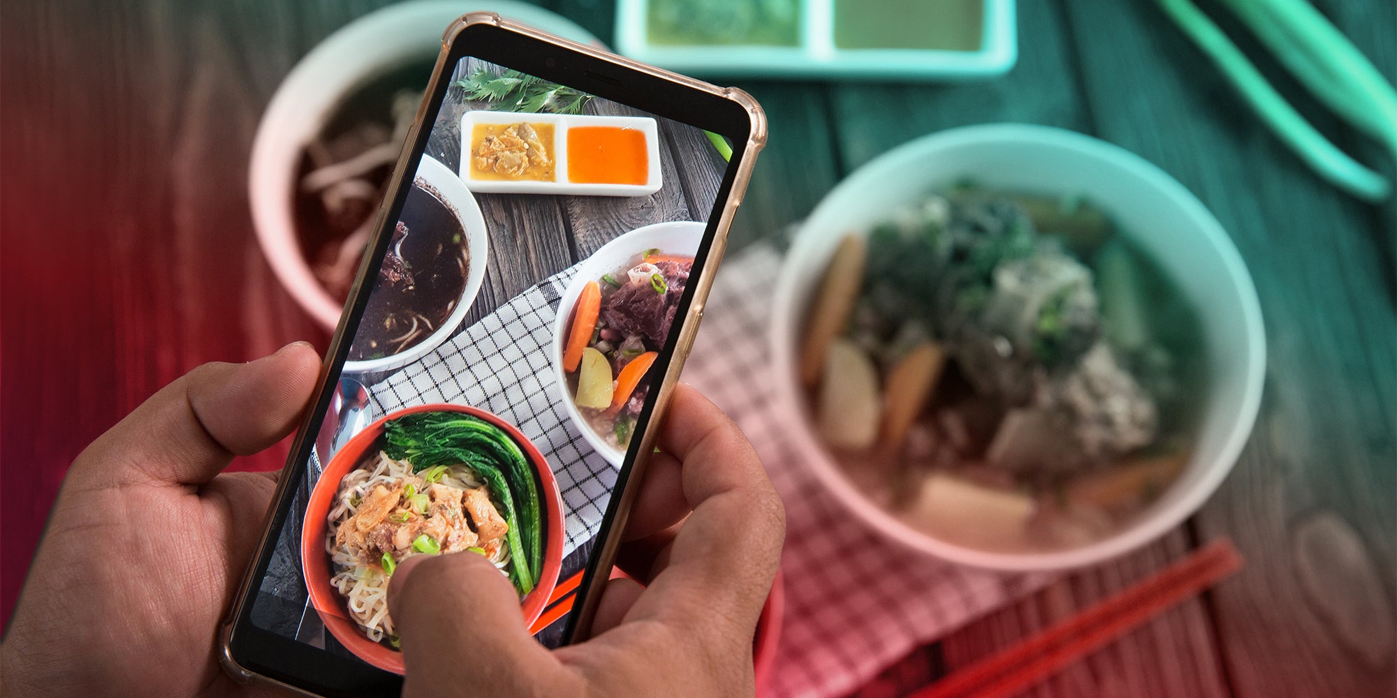 person taking video of asian food