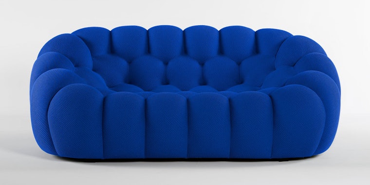 blue bubble seat sofa in front of white background