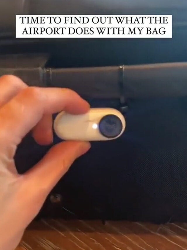 Traveler Puts Camera on Luggage at the Airport