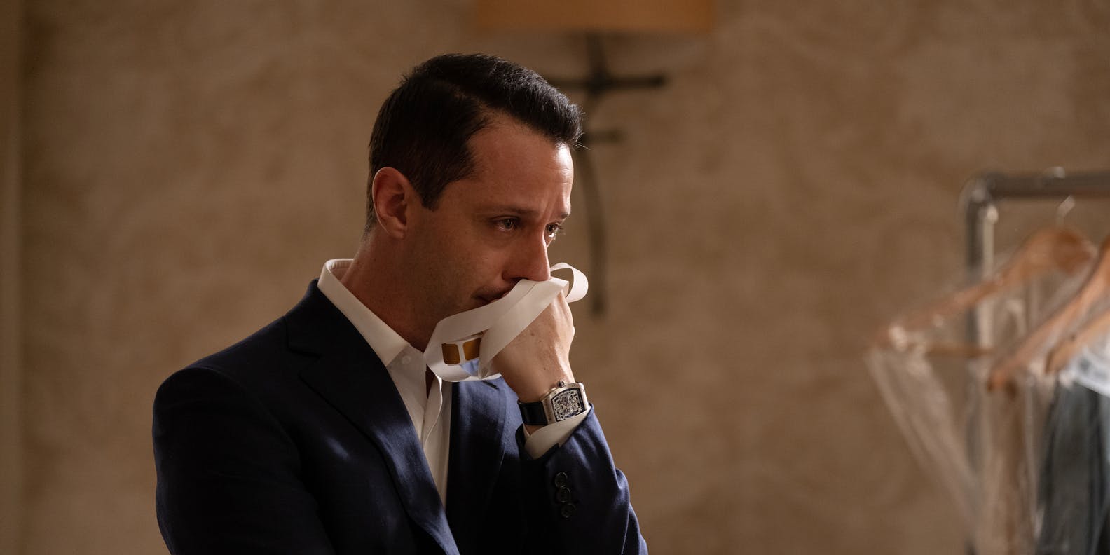 actor jeremy strong weeping in a suit in the finale of succession