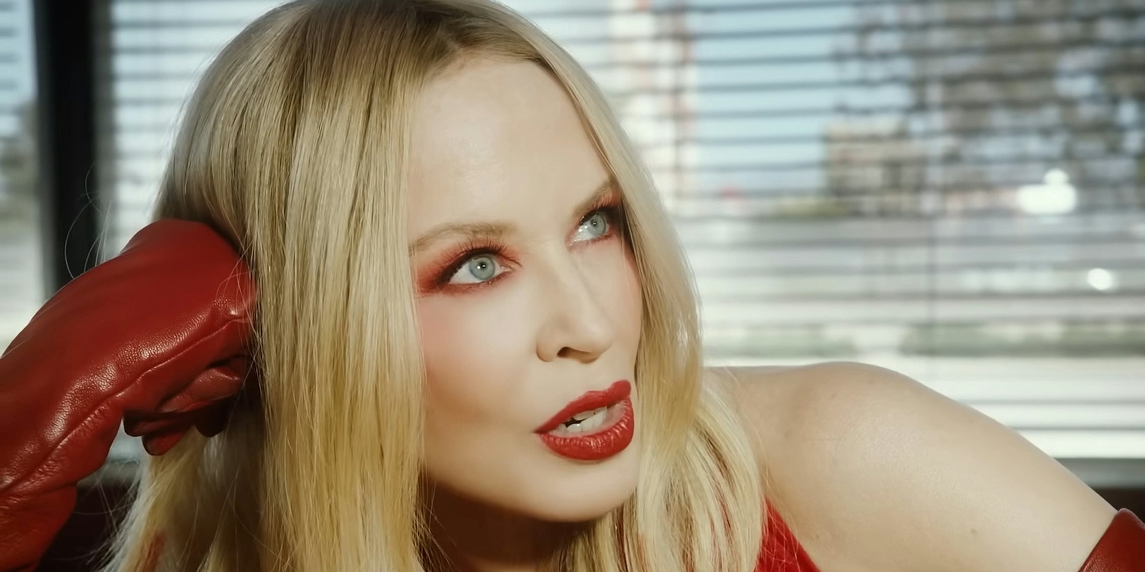 Kylie Minogue singing in Padam Padam music video