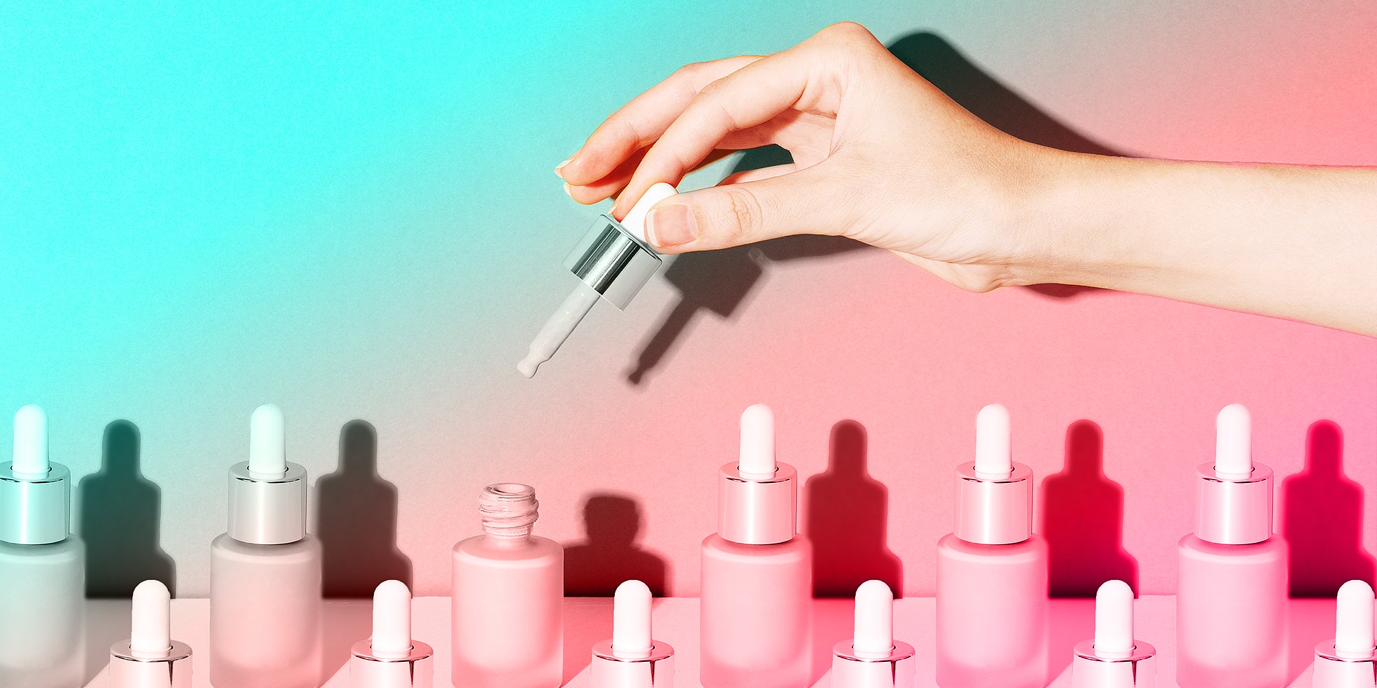 A female hand holds a dropper for applying bb foundation cream. Opened and closed jars of a cosmetic makeup product on a beige background. Pattern of beauty products packaging