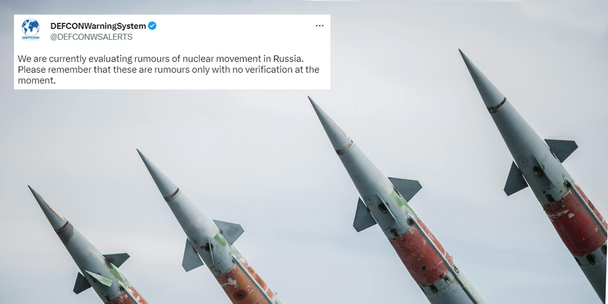Nuclear Missiles With Warhead Aimed at Gloomy Sky with Tweet in top left corner by @DEFCONWSALERTS "We are currently evaluating rumours of nuclear movement in Russia. Please remember that these are rumours only with no verification at the moment."