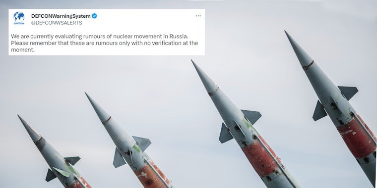 Nuclear Missiles With Warhead Aimed at Gloomy Sky with Tweet in top left corner by @DEFCONWSALERTS 'We are currently evaluating rumours of nuclear movement in Russia. Please remember that these are rumours only with no verification at the moment.'