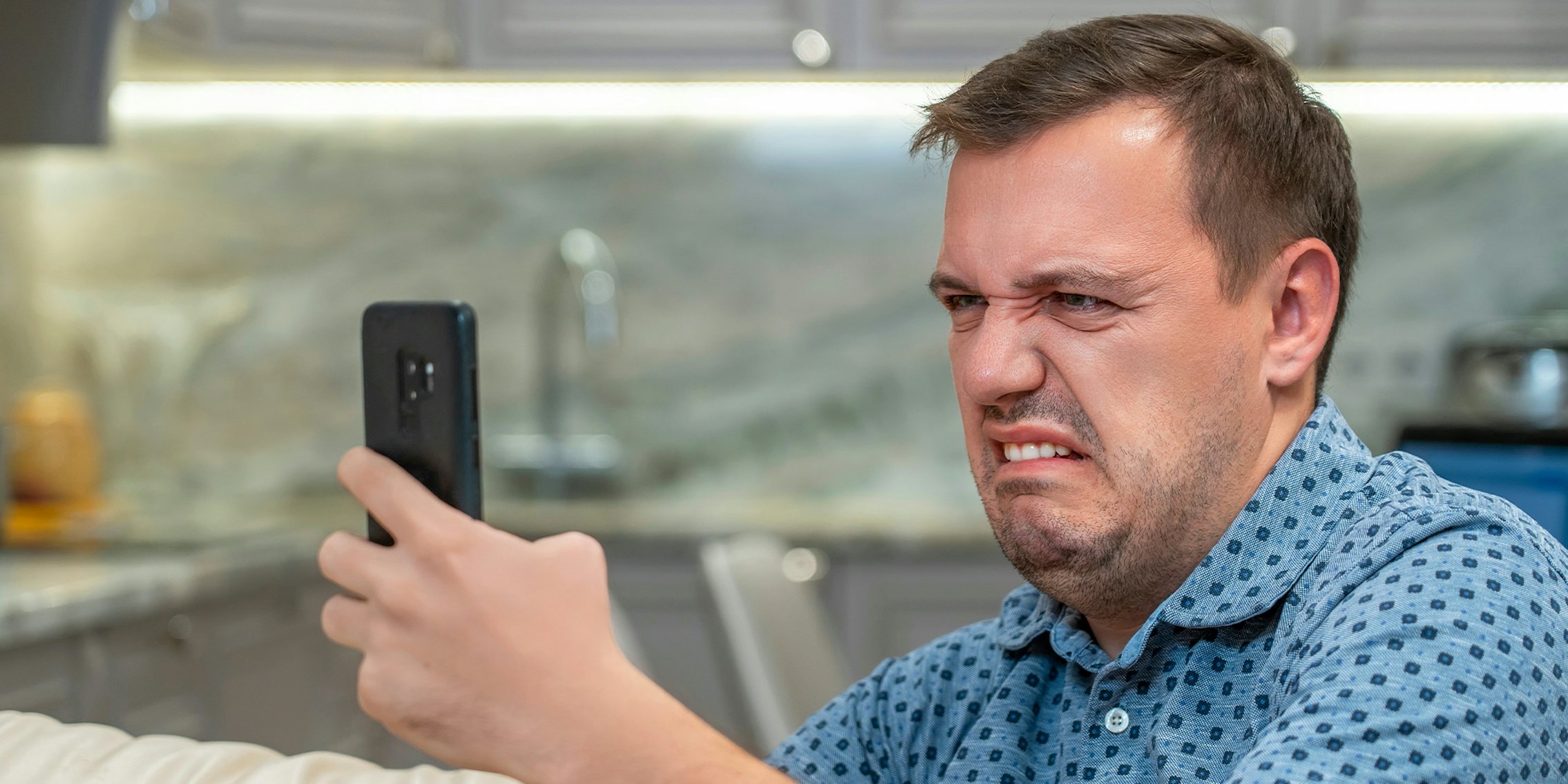 What is cringe? Portrait of man with cringe and looking at phone screen with squeamishness, bad joke or inappropriate content.