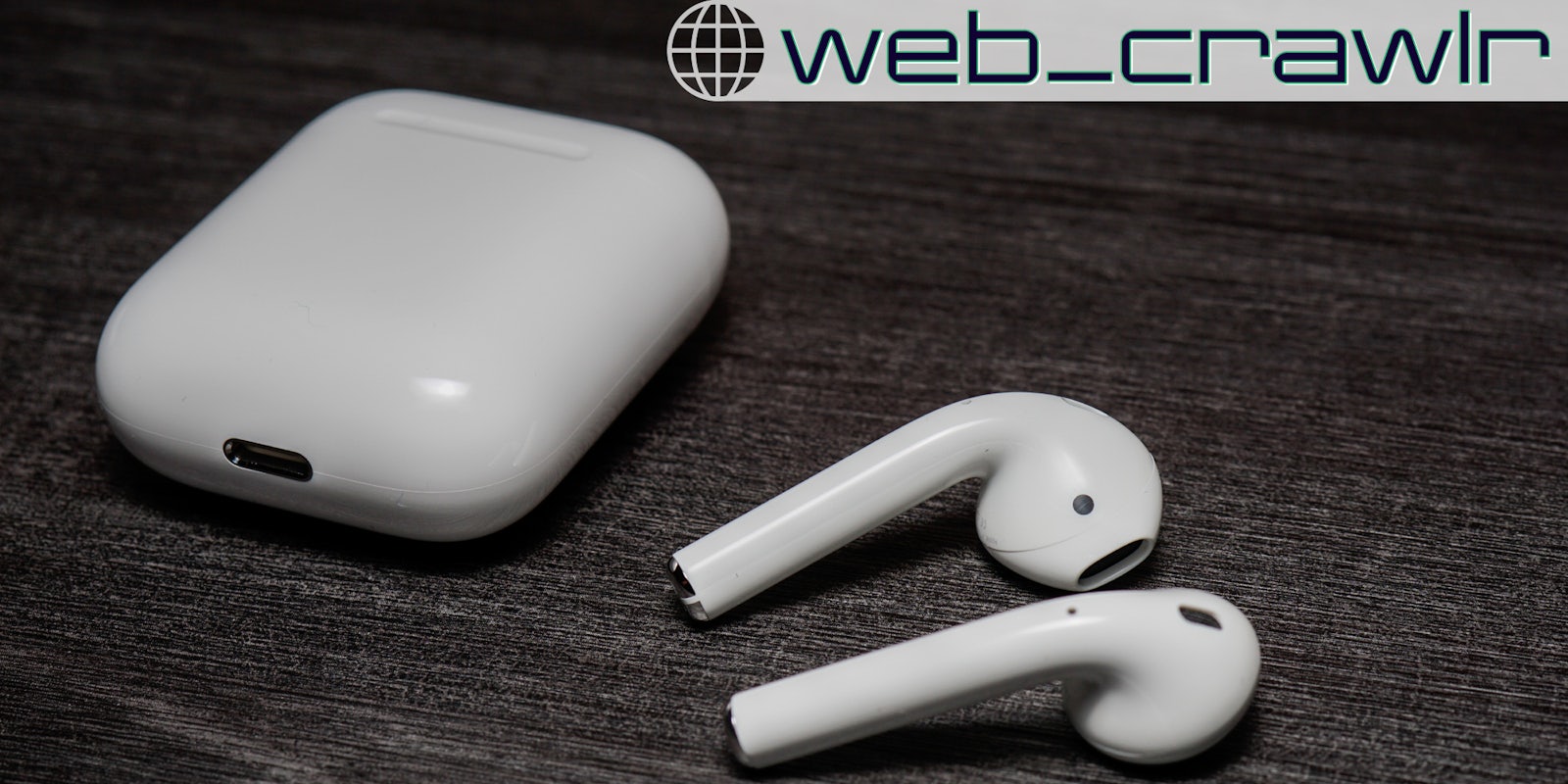 Apple AirPods on a table. The Daily Dot newsletter web_crawlr logo is in the top right corner.