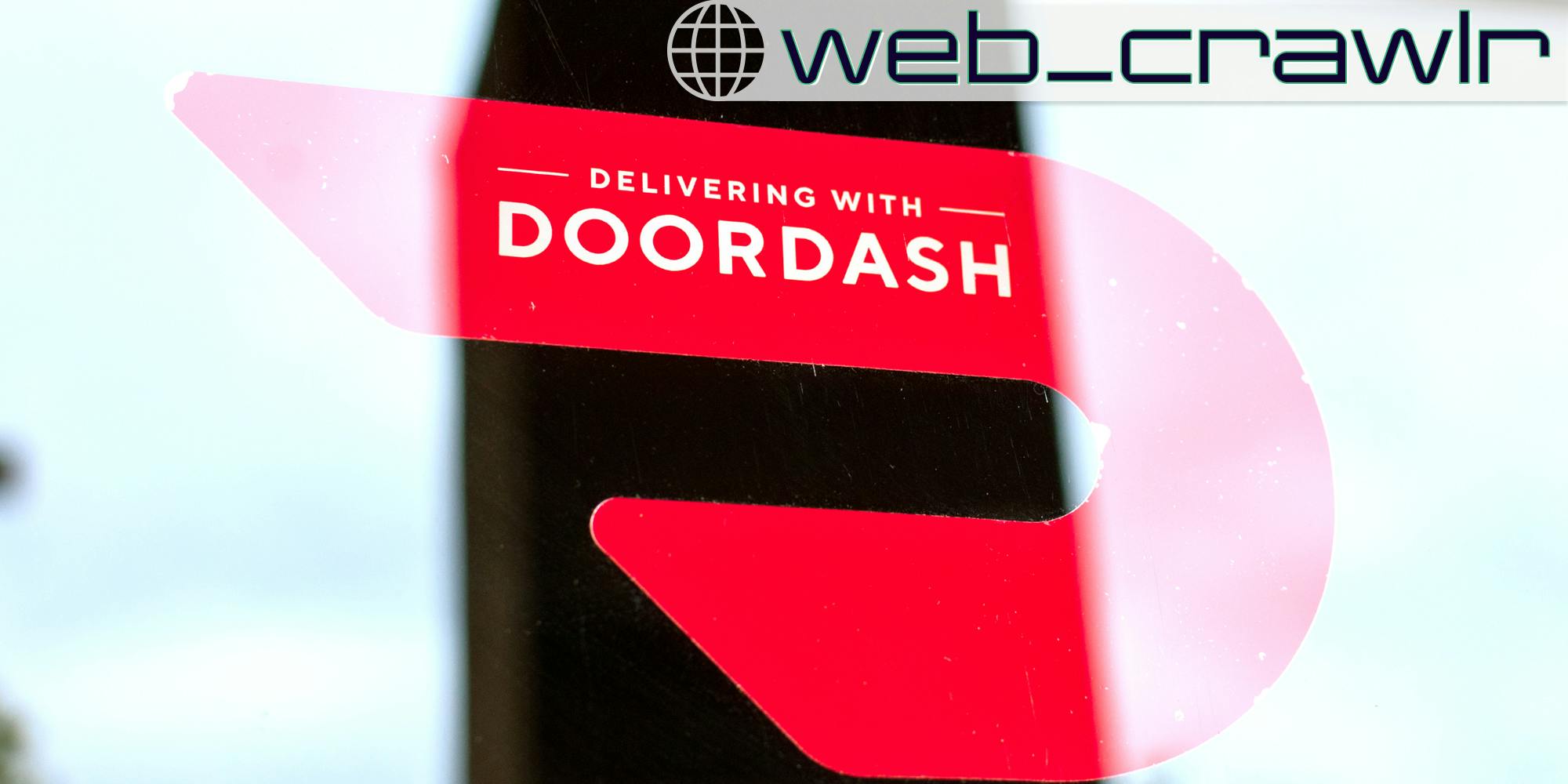 A sticker that says 'Delivering with DoorDash.' The Daily Dot newsletter web_crawlr logo is in the top right corner.