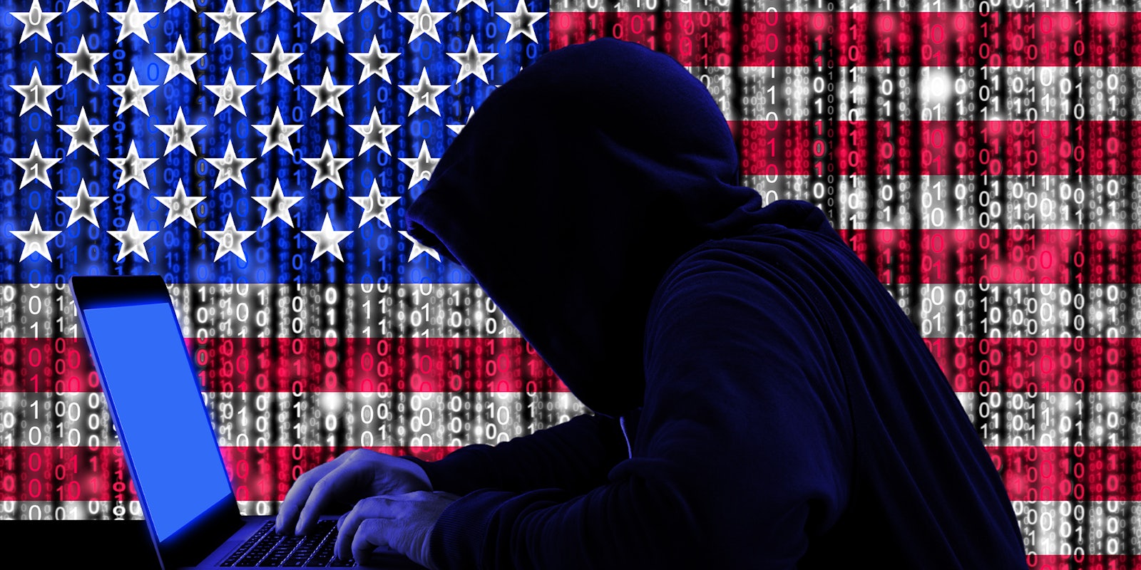 Hacker in a dark hoody sitting in front of a notebook with digital us flag and binary streams background cybersecurity concept