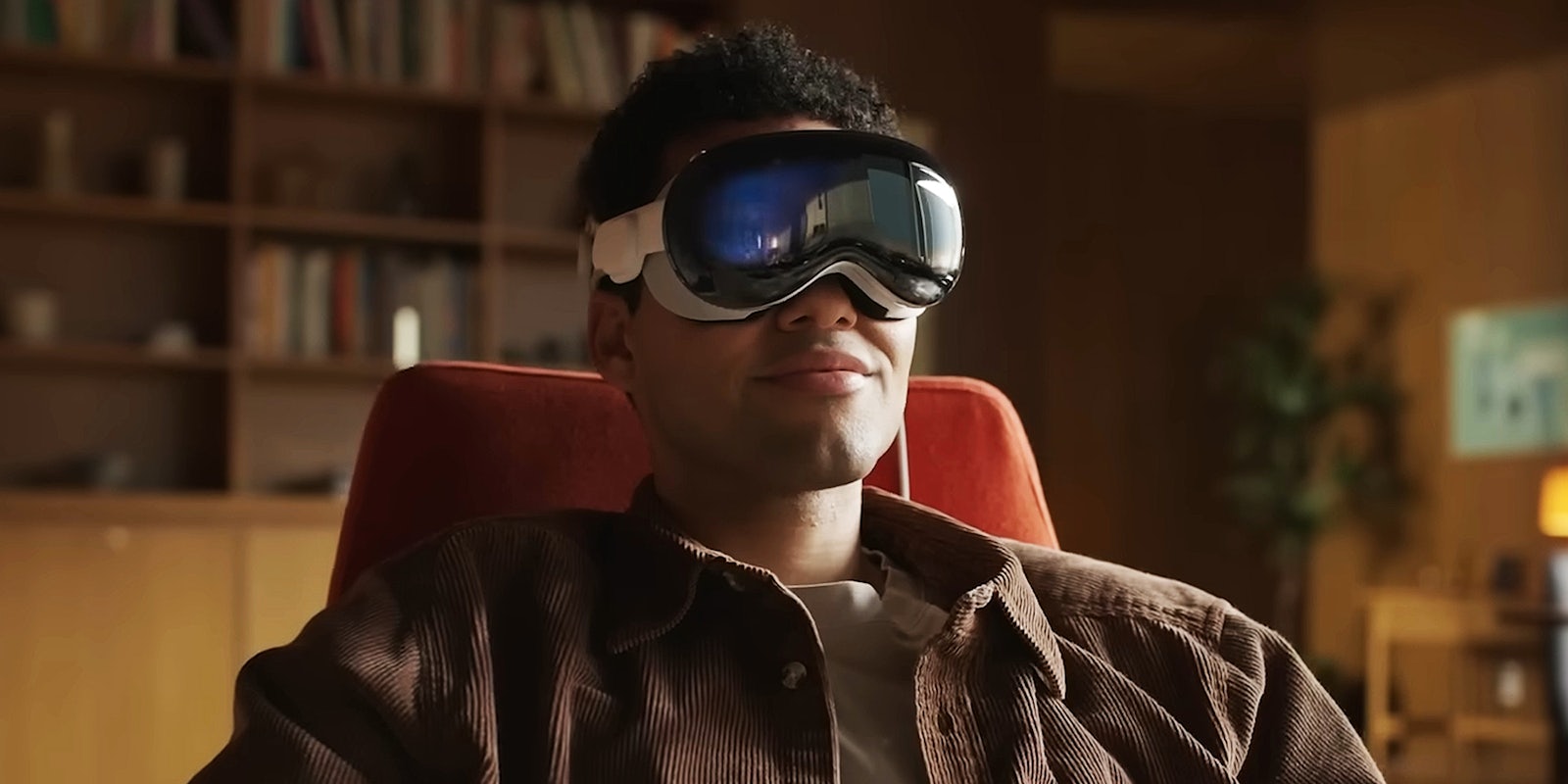 man with Apple Vision Pro Headset on in living room