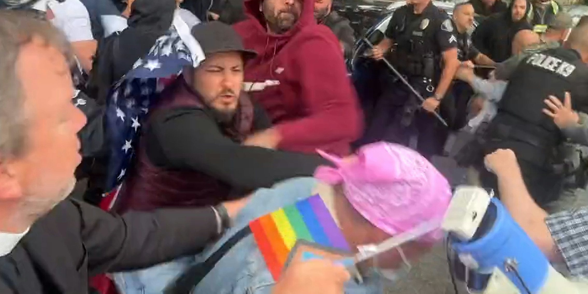 man with American flag punching person with Pride flag in Glendale Pride fight