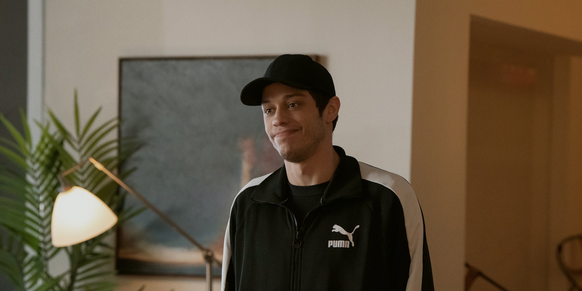 pete davidson wearing a black baseball cap