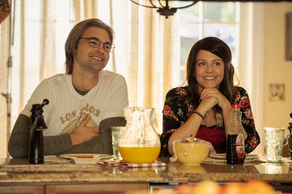 Drew Tarver and Heléne Yorke at table
