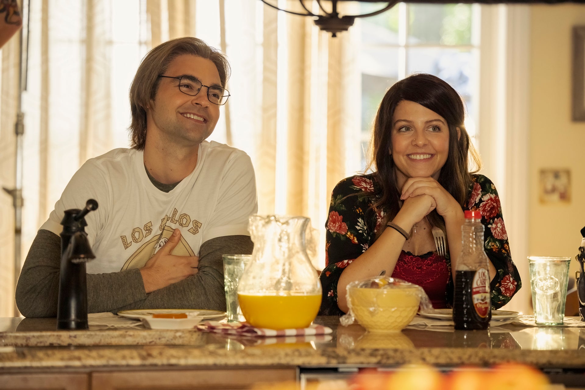 Drew Tarver and Heléne Yorke at table