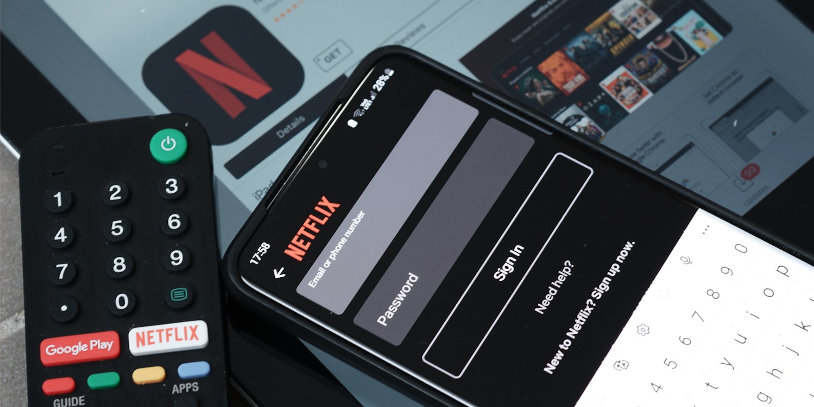Netflix open on phone and tablet with remote