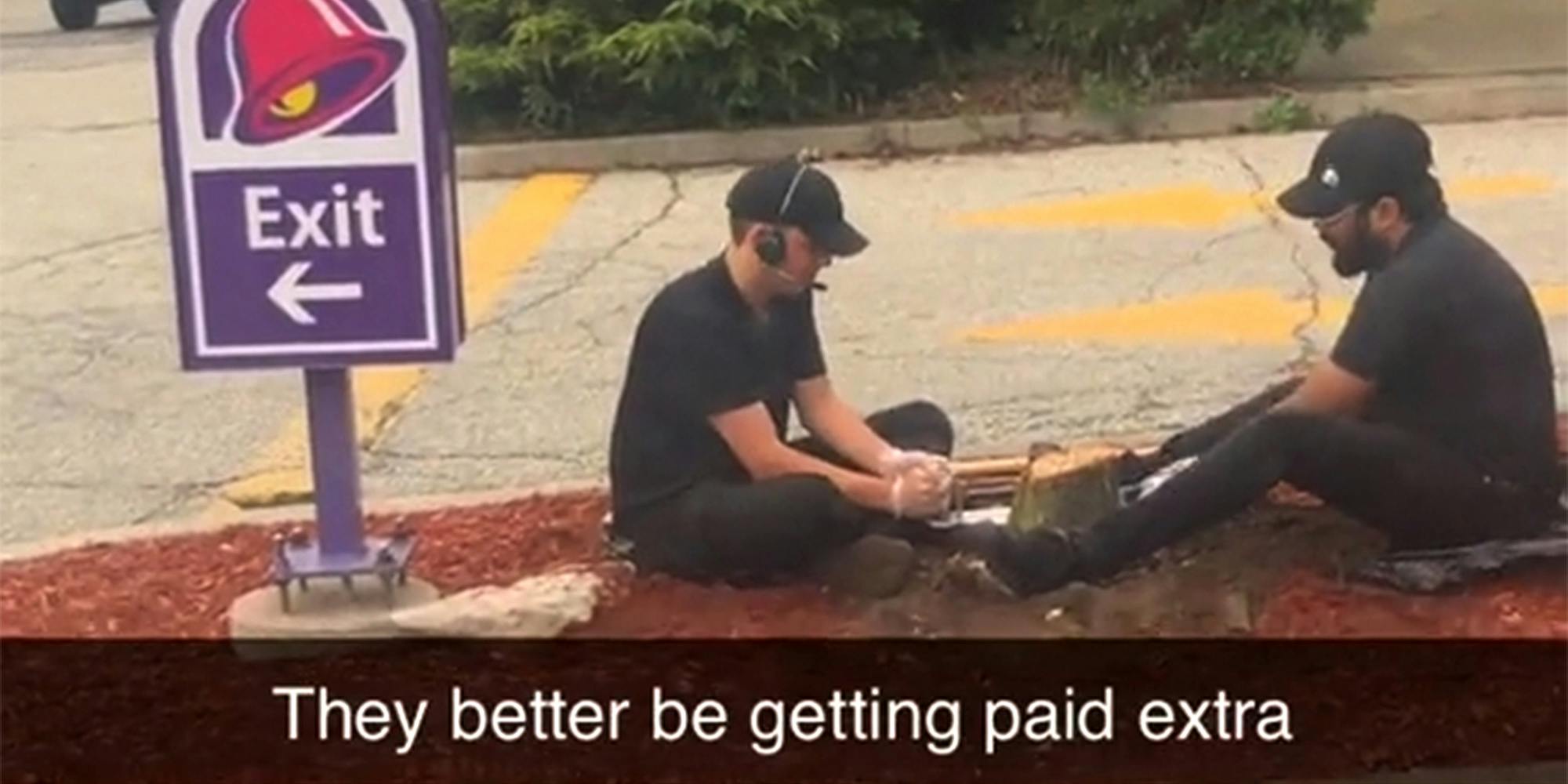 taco bell employees cutting stump in drive-thru