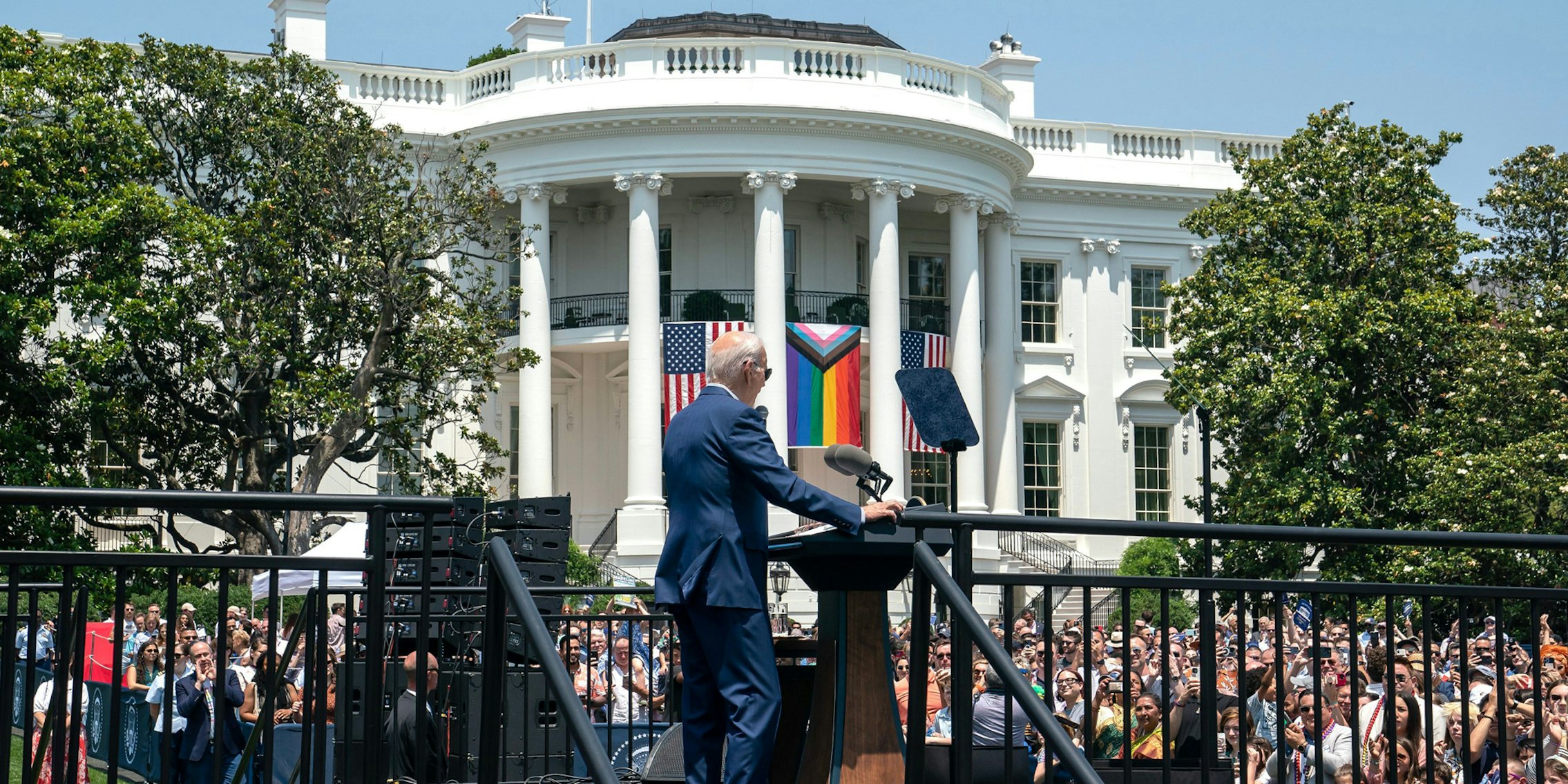 Joe Biden speaking at Pride Month Celebration Event at the White House, Washington, District of Columbia, United States with Pride flag hung up