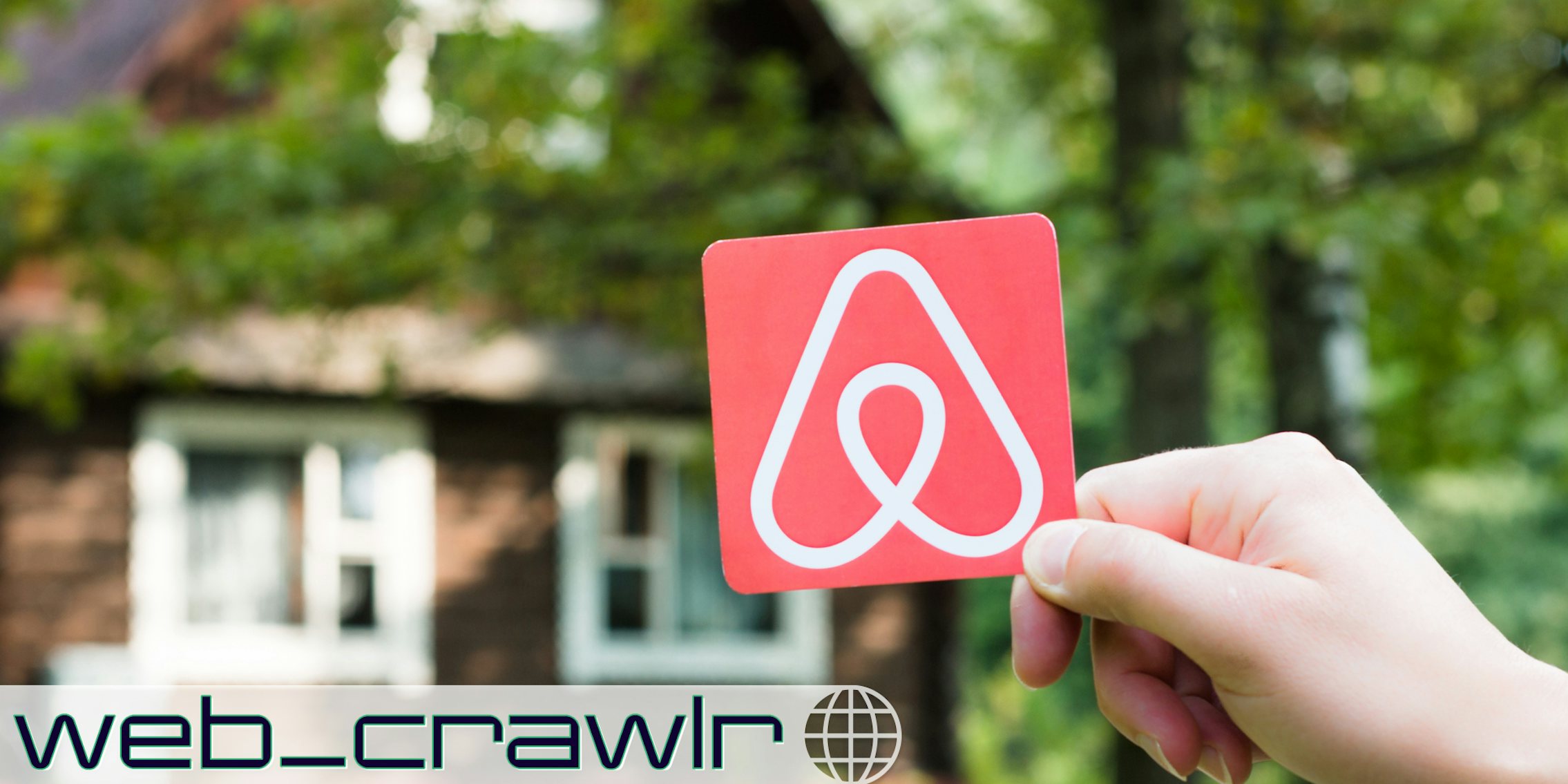 A house with an Airbnb card in front of it. The Daily Dot newsletter web_crawlr logo is in the bottom left corner.