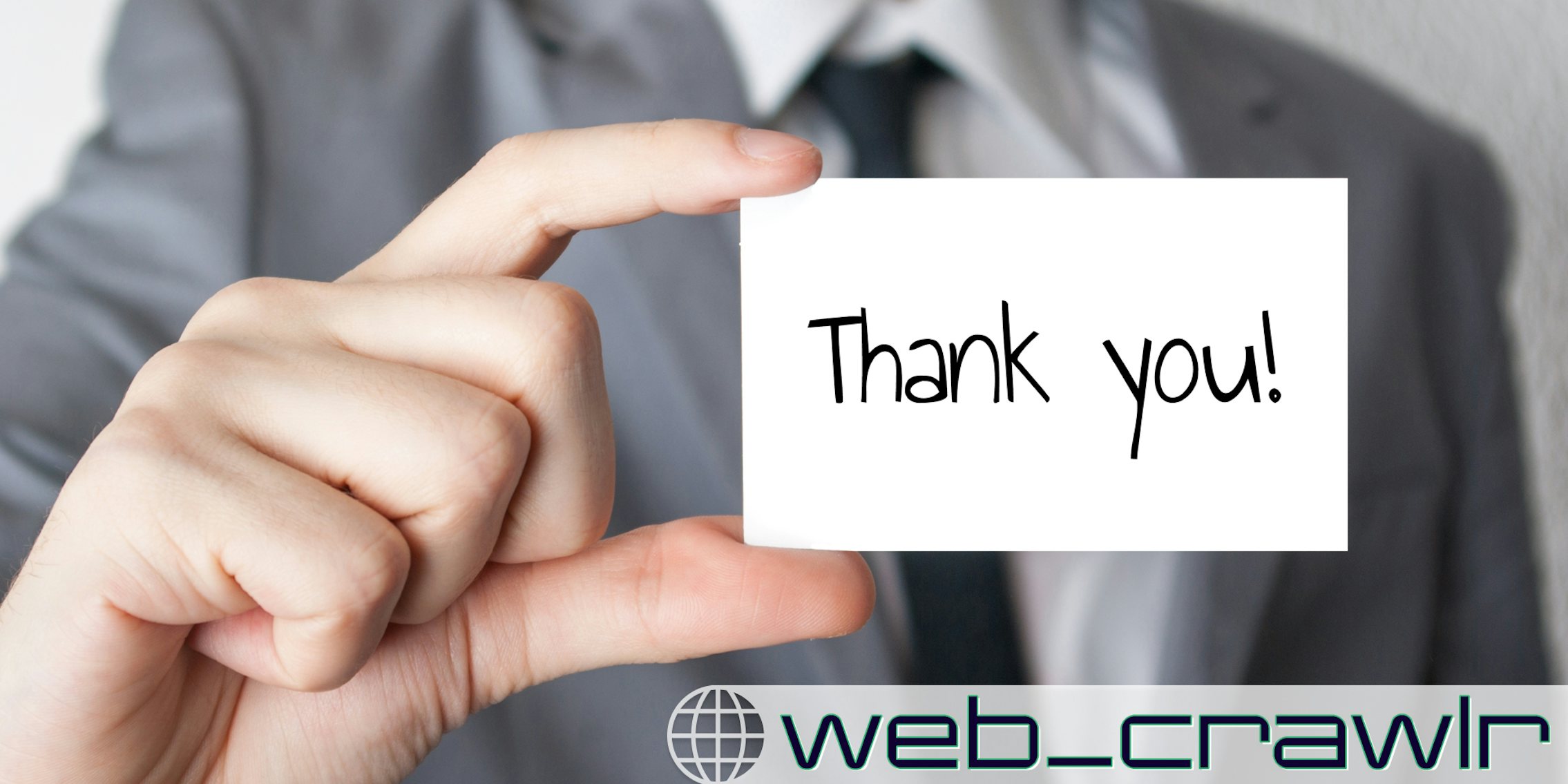 A businessman holding a card that says 'thank you.' The Daily Dot newsletter web_crawlr logo is in the bottom right corner.
