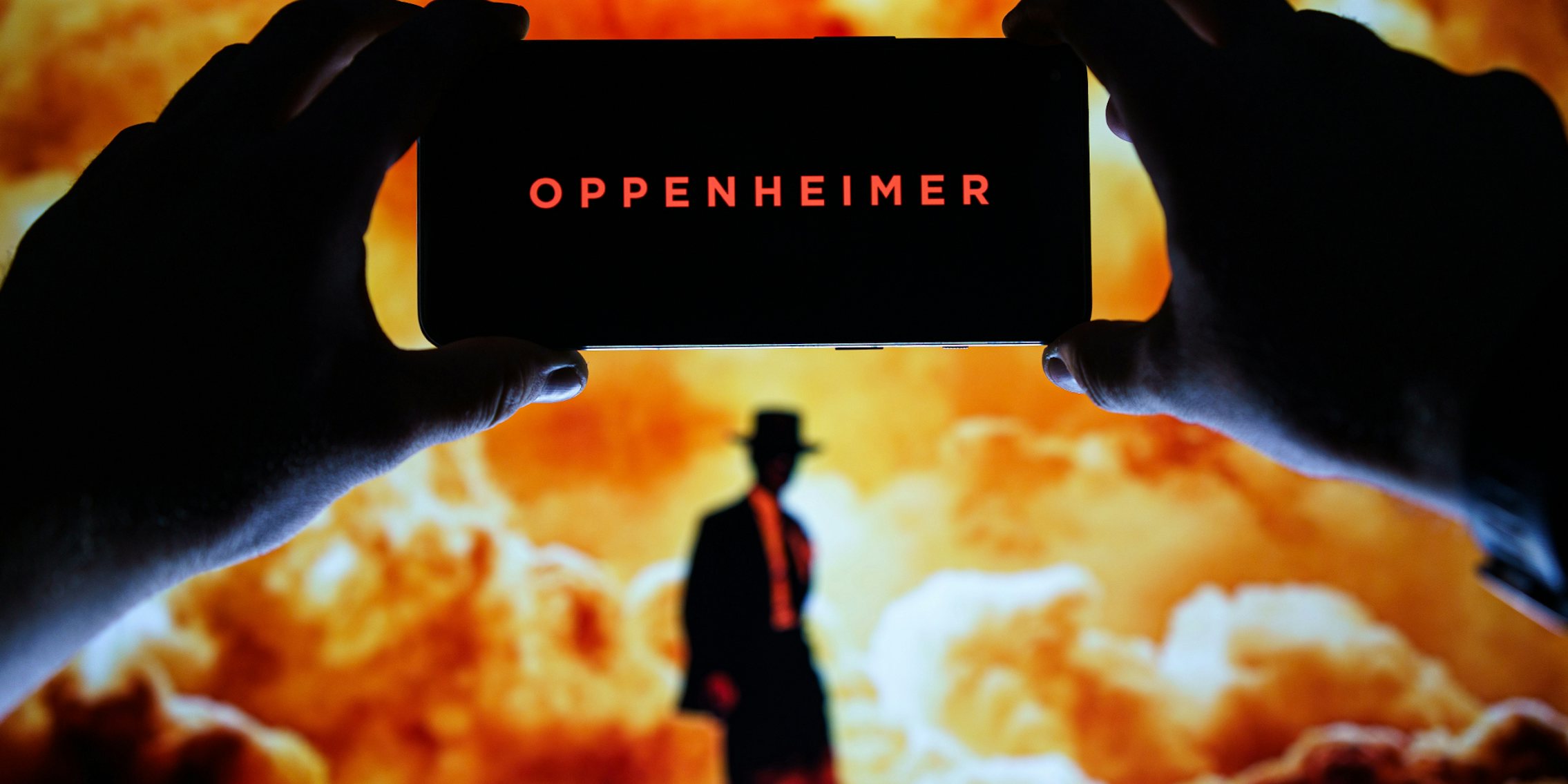 Oppenheimer movie logo and poster on screen.
