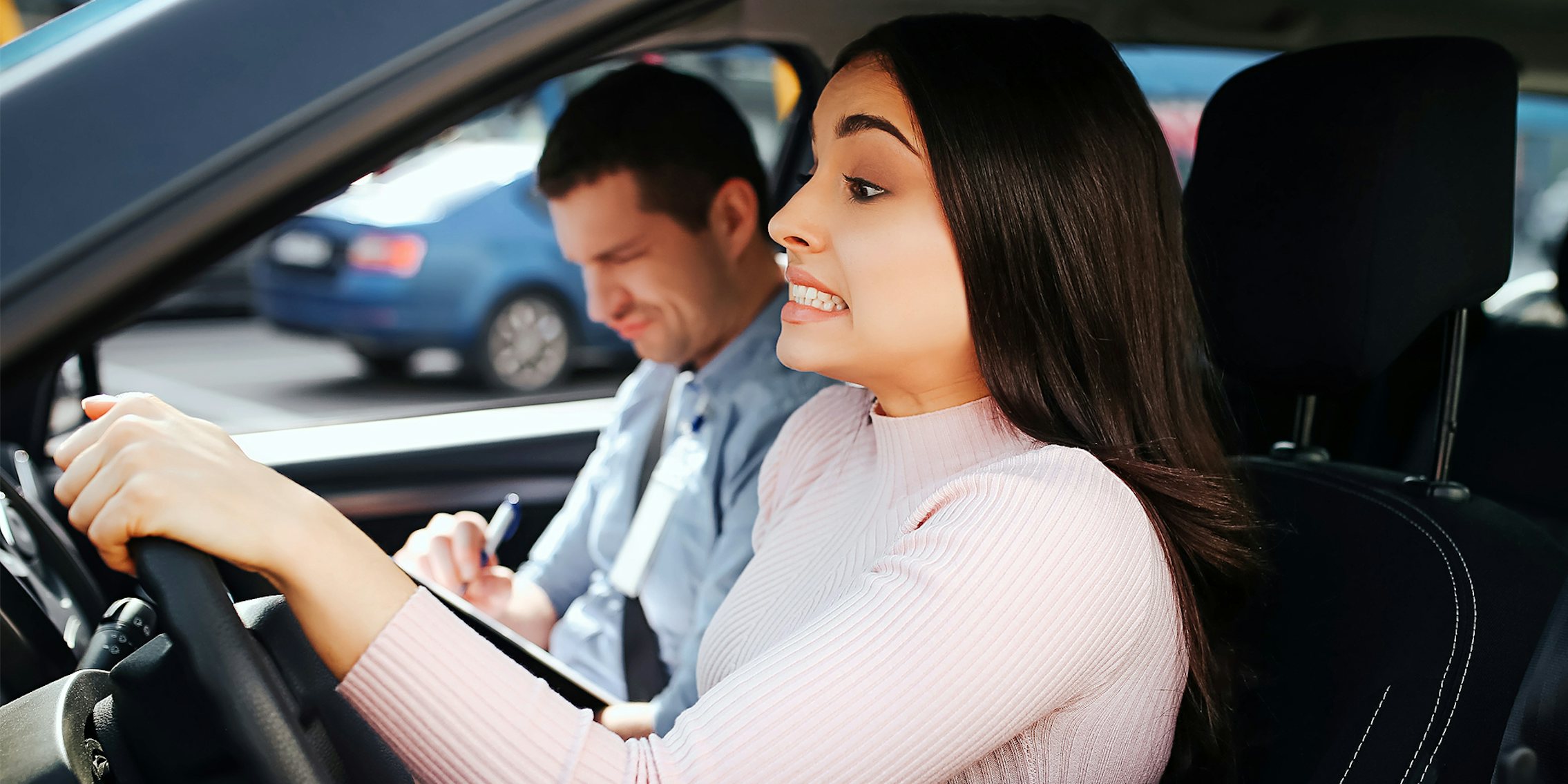 young woman taking driving exam