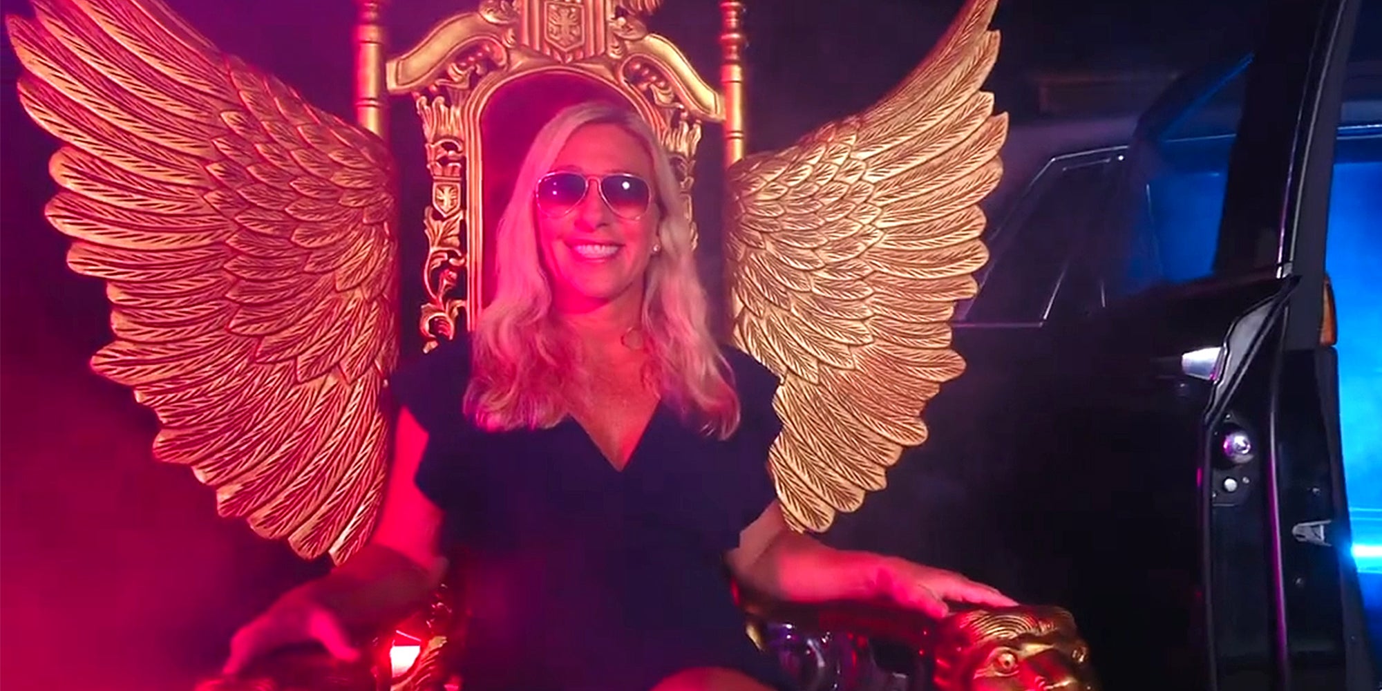 marjorie taylor green sitting on winged throne in rap video