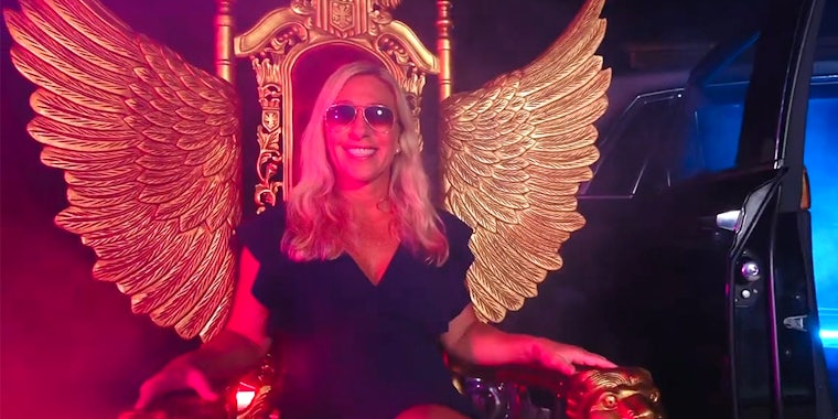 marjorie taylor green sitting on winged throne in rap video